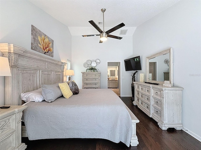 13627 Glaze Brook Dr, Hudson, FL 34667 - bedroom featuring lofted ceiling, dark wood-type flooring, baseboards, a ceiling fan, and connected bathroom
