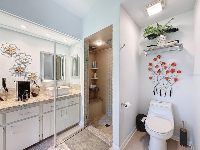 13627 Glaze Brook Dr, Hudson, FL 34667 - full bath with tile patterned floors, a tile shower, toilet, vanity, and baseboards