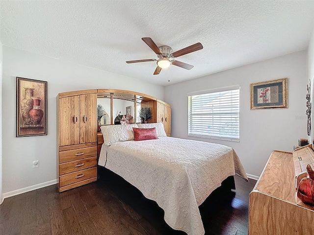 13627 Glaze Brook Dr, Hudson, FL 34667 - bedroom with dark wood finished floors, baseboards, ceiling fan, and a textured ceiling