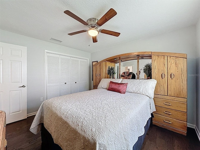 13627 Glaze Brook Dr, Hudson, FL 34667 - bedroom with dark wood finished floors, a closet, baseboards, and ceiling fan