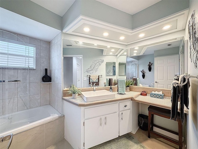 13627 Glaze Brook Dr, Hudson, FL 34667 - bathroom featuring tiled shower / bath combo, vanity, and recessed lighting