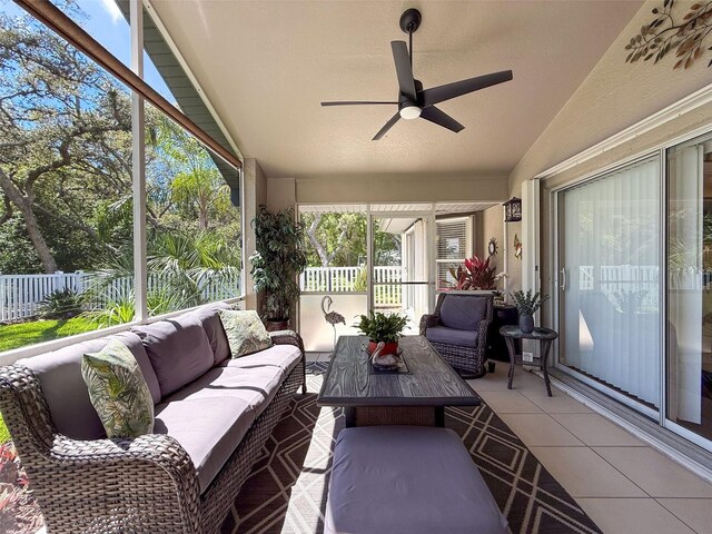 13627 Glaze Brook Dr, Hudson, FL 34667 - sunroom / solarium featuring lofted ceiling, outdoor lounge area, ceiling fan, and tile patterned flooring