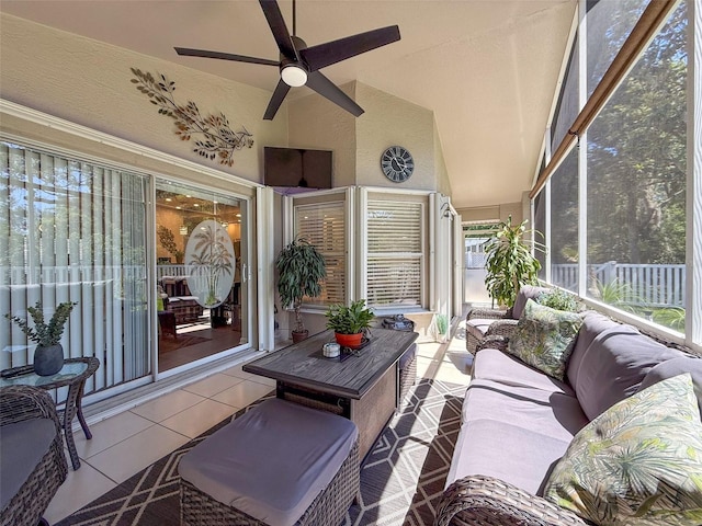 13627 Glaze Brook Dr, Hudson, FL 34667 - sunroom with outdoor lounge area, tile patterned floors, ceiling fan, and vaulted ceiling