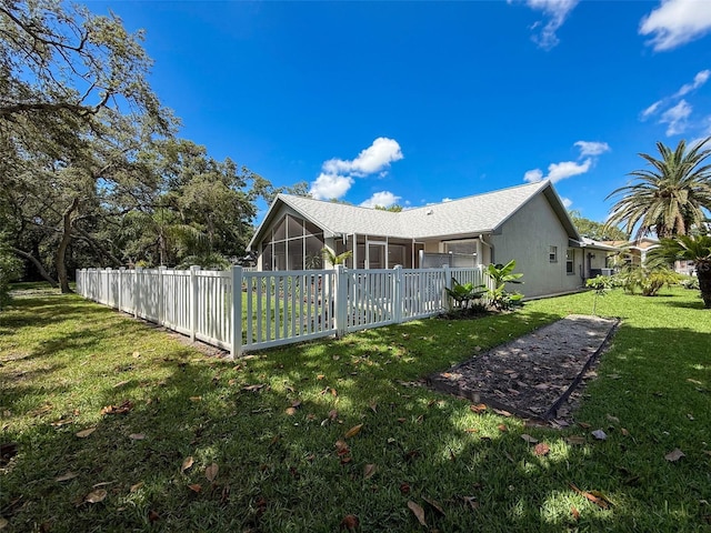 13627 Glaze Brook Dr, Hudson, FL 34667 - view of home's exterior with a sunroom and stucco siding