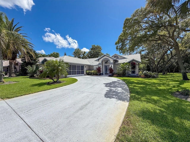 13627 Glaze Brook Dr, Hudson, FL 34667 - ranch-style house with curved driveway and a front lawn