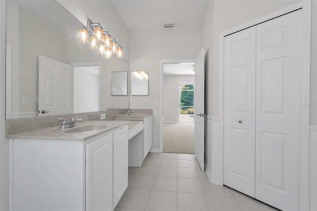 10344 Tecoma Dr, Trinity, FL 34655 - bathroom with vanity, tile patterned flooring, baseboards, and a ceiling fan