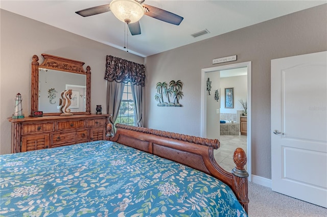 3546 Flamingo Blvd, Hernando Beach, FL 34607 - carpeted bedroom with ensuite bath, ceiling fan, and baseboards