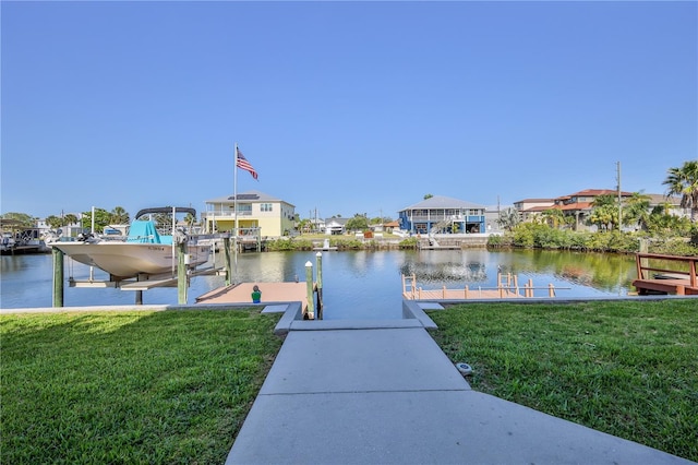 3546 Flamingo Blvd, Hernando Beach, FL 34607 - dock featuring boat lift, a yard, and a water view
