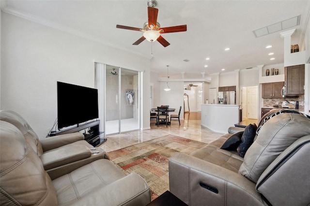 living area with ceiling fan, crown molding, recessed lighting, light marble finish floors, and baseboards