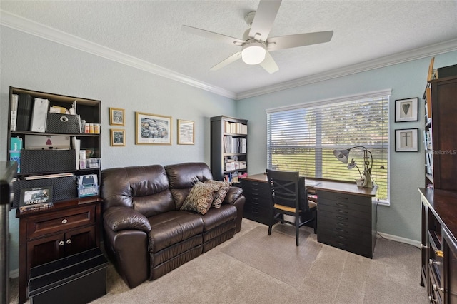 home office featuring carpet floors, a ceiling fan, ornamental molding, and a textured ceiling