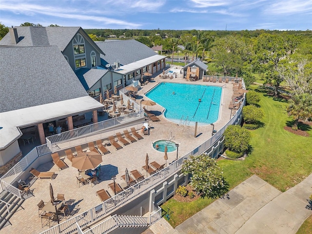 community pool with a patio area