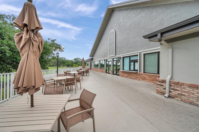 view of patio featuring outdoor dining area