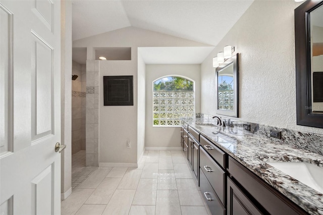 18520 Hidden Pines Way, Hudson, FL 34667 - bathroom with lofted ceiling, double vanity, a walk in shower, and baseboards