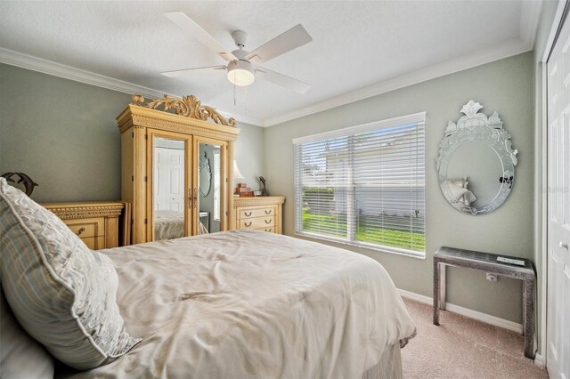 18520 Hidden Pines Way, Hudson, FL 34667 - bedroom featuring light carpet, ornamental molding, baseboards, and a ceiling fan