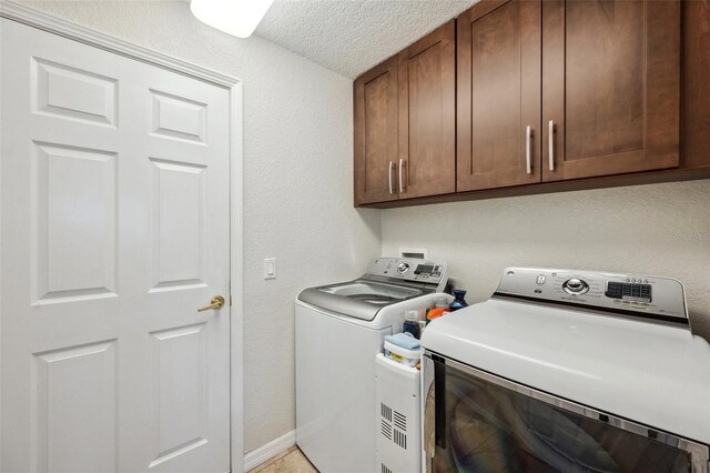 18520 Hidden Pines Way, Hudson, FL 34667 - laundry area with independent washer and dryer, cabinet space, a textured ceiling, and a textured wall