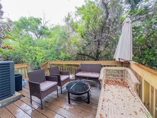 12408 Country White Cir, Tampa, FL 33635 - wooden deck featuring an outdoor living space with a fire pit and central air condition unit