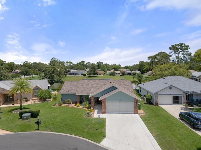 ranch-style home with brick siding, a residential view, a front yard, concrete driveway, and an attached garage