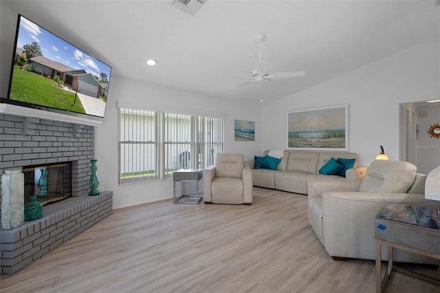 living room featuring lofted ceiling, ceiling fan, wood finished floors, baseboards, and recessed lighting