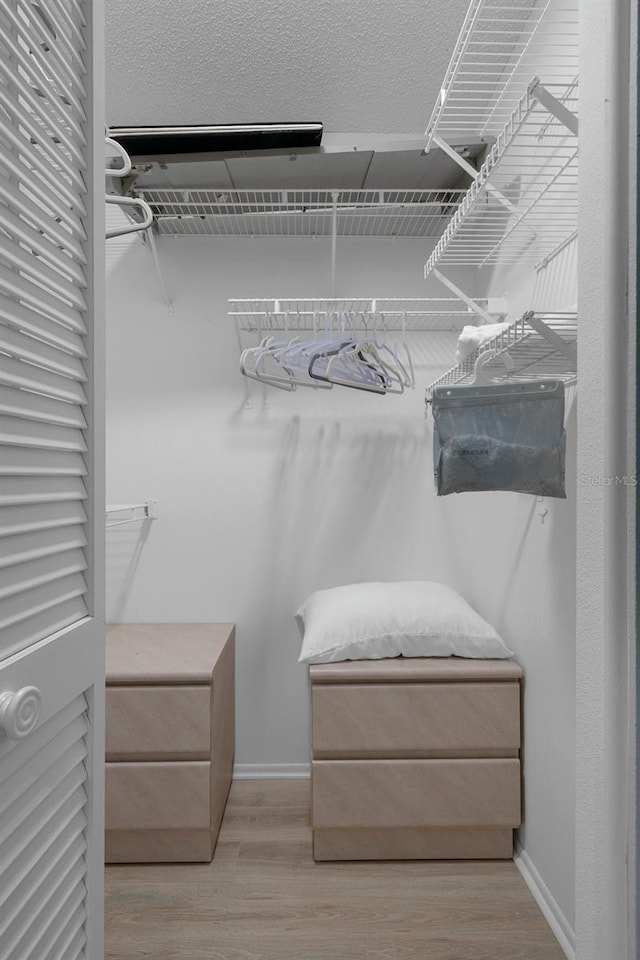spacious closet with wood finished floors