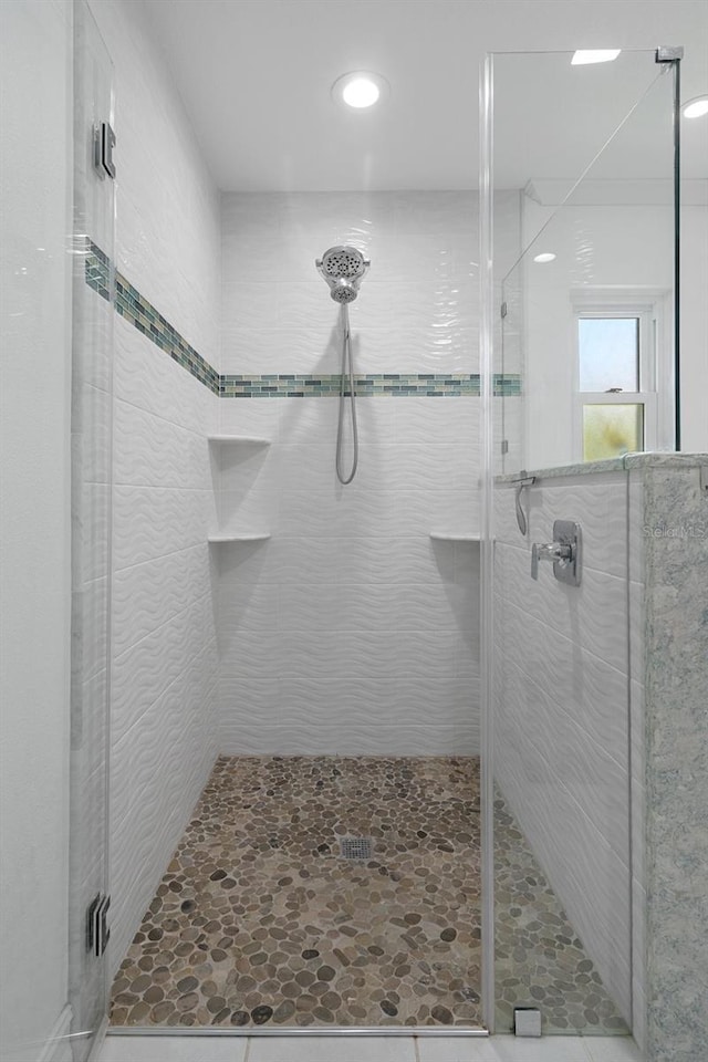 bathroom featuring a shower stall and recessed lighting