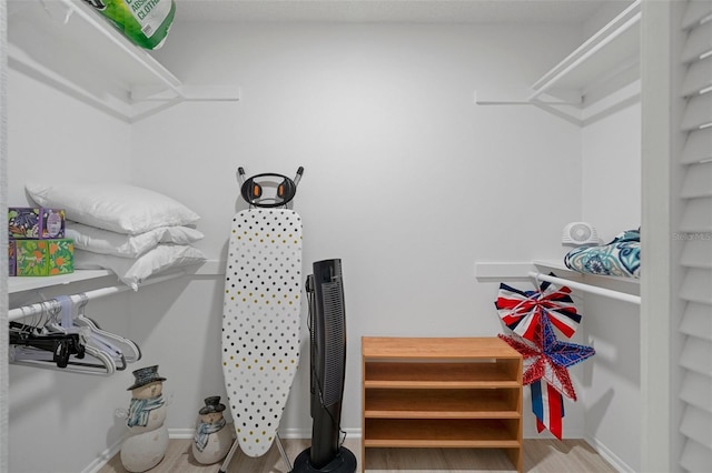 spacious closet with wood finished floors