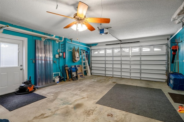 garage featuring a garage door opener and a ceiling fan