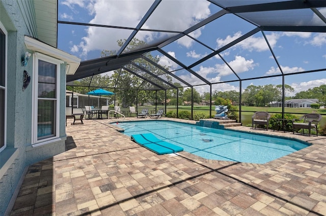 swimming pool featuring a patio, a lanai, and outdoor dining space