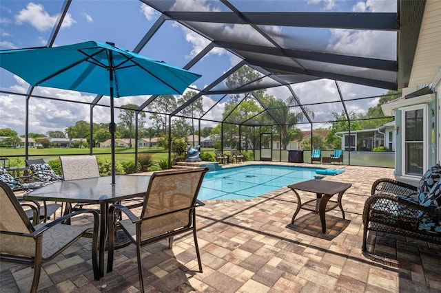 swimming pool with a patio area, outdoor dining space, and a lanai