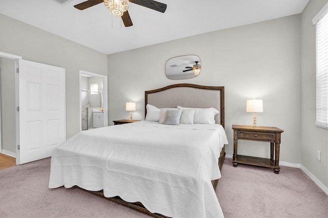 12854 Rangeland Blvd, Odessa, FL 33556 - bedroom with carpet floors, baseboards, ensuite bath, and ceiling fan