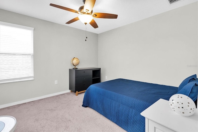 12854 Rangeland Blvd, Odessa, FL 33556 - bedroom with light carpet, multiple windows, baseboards, and ceiling fan