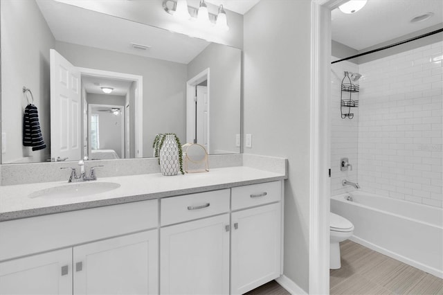 12854 Rangeland Blvd, Odessa, FL 33556 - bathroom featuring toilet, vanity, shower / bathtub combination, and baseboards
