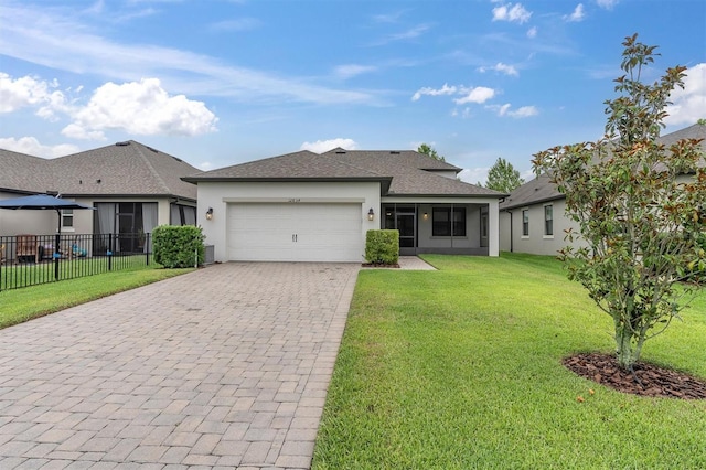 12854 Rangeland Blvd, Odessa, FL 33556 - view of front of property featuring a garage, stucco siding, decorative driveway, a shingled roof, and a sunroom