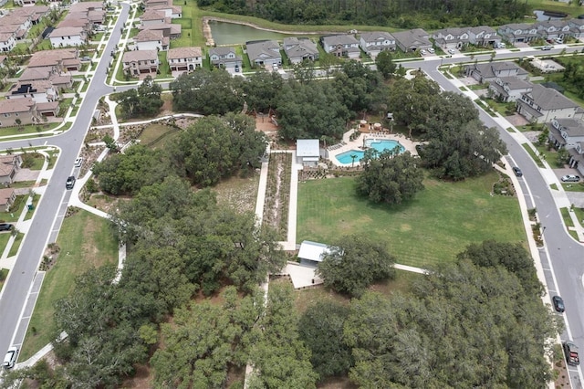 12854 Rangeland Blvd, Odessa, FL 33556 - aerial view of property and surrounding area featuring nearby suburban area, a pool area, and a nearby body of water