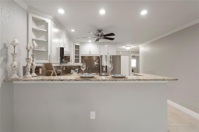 5045 Pelican Dr, New Port Richey, FL 34652 - kitchen featuring appliances with stainless steel finishes, a peninsula, ceiling fan, recessed lighting, and ornamental molding