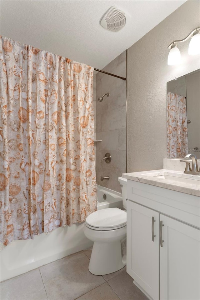 5045 Pelican Dr, New Port Richey, FL 34652 - bathroom featuring vanity, tile patterned flooring, shower / bathtub combination with curtain, a textured wall, and toilet