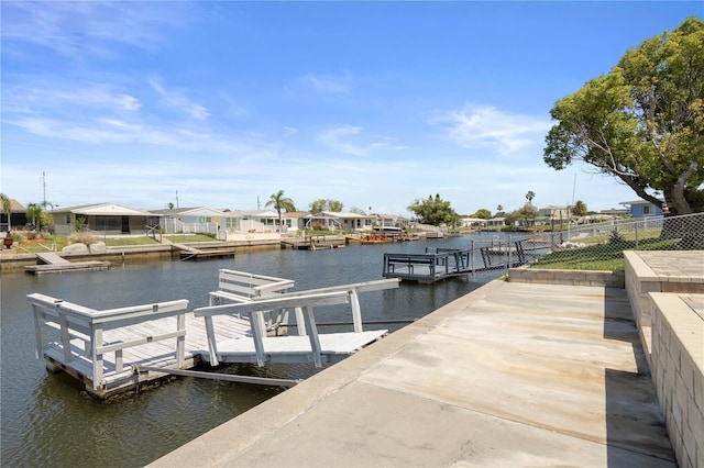 5045 Pelican Dr, New Port Richey, FL 34652 - dock area with a water view, a residential view, and a boat ramp