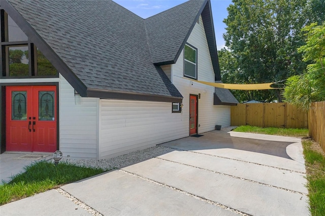 7422 New York Ave, Hudson, FL 34667 - view of side of property with roof with shingles