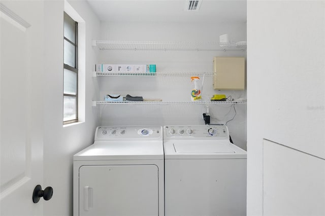 7422 New York Ave, Hudson, FL 34667 - laundry room with washer and dryer and healthy amount of natural light