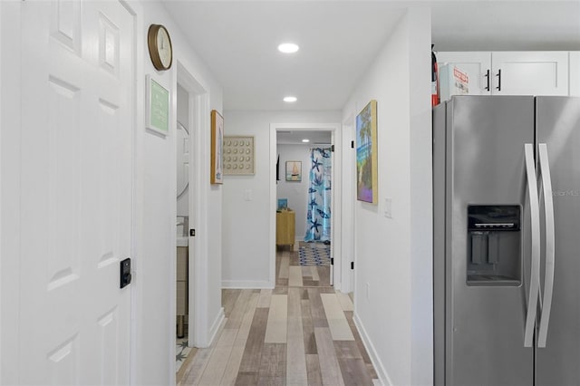 7422 New York Ave, Hudson, FL 34667 - hall with light wood-style floors, recessed lighting, and baseboards