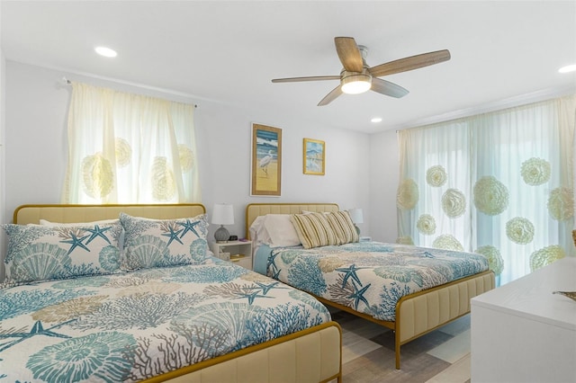 7422 New York Ave, Hudson, FL 34667 - bedroom with wood finished floors, recessed lighting, and a ceiling fan