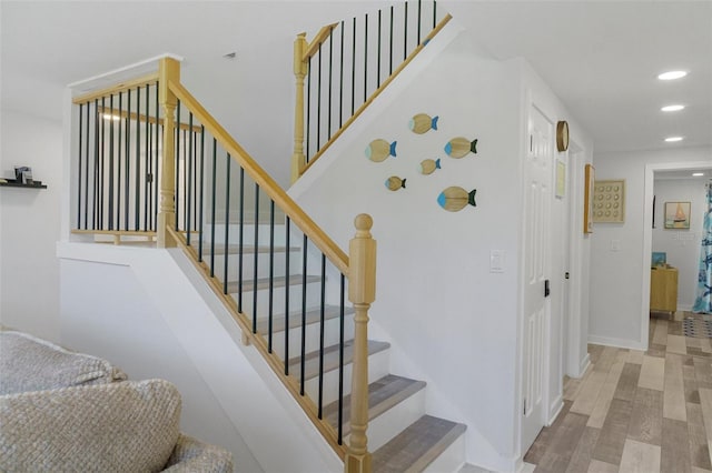 7422 New York Ave, Hudson, FL 34667 - stairway with recessed lighting, wood finished floors, and baseboards