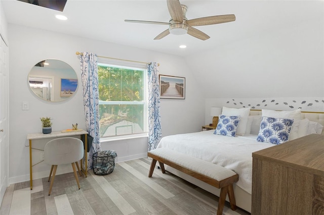 7422 New York Ave, Hudson, FL 34667 - bedroom with wood finished floors, baseboards, vaulted ceiling, a ceiling fan, and recessed lighting