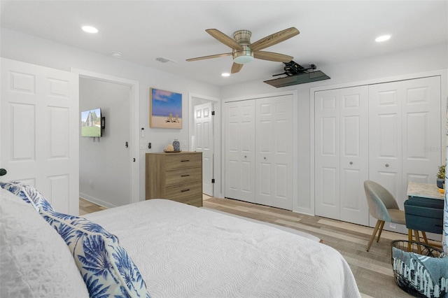 7422 New York Ave, Hudson, FL 34667 - bedroom featuring light wood-style flooring, two closets, recessed lighting, baseboards, and a ceiling fan