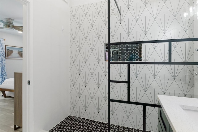 7422 New York Ave, Hudson, FL 34667 - ensuite bathroom with a ceiling fan and tile patterned flooring