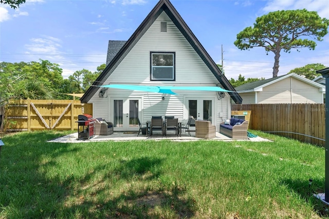 7422 New York Ave, Hudson, FL 34667 - rear view of house with french doors, a patio, and an outdoor hangout area