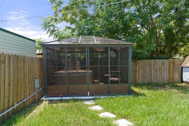7422 New York Ave, Hudson, FL 34667 - view of outbuilding with a hot tub and a fenced backyard