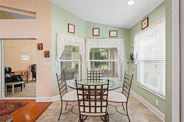 12071 Wexford Blvd, Spring Hill, FL 34609 - dining space with vaulted ceiling and baseboards