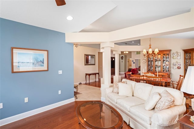 12071 Wexford Blvd, Spring Hill, FL 34609 - living room with ornate columns, recessed lighting, ceiling fan, wood finished floors, and baseboards