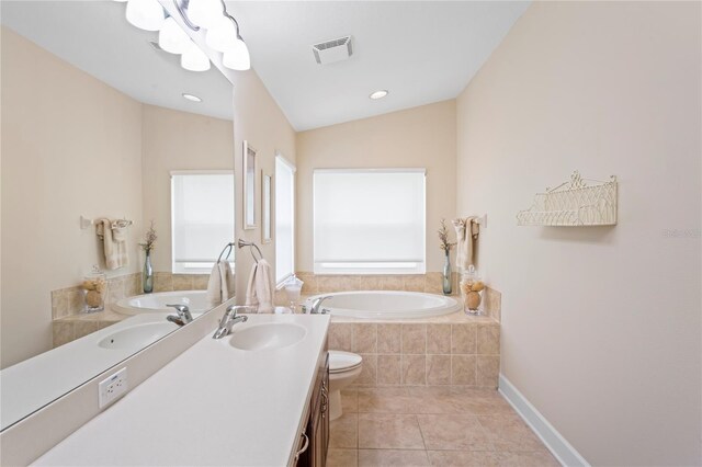 12071 Wexford Blvd, Spring Hill, FL 34609 - full bathroom featuring tile patterned floors, a bath, vanity, toilet, and lofted ceiling