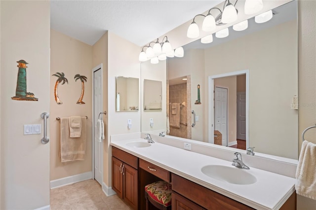 12071 Wexford Blvd, Spring Hill, FL 34609 - full bath featuring double vanity, tile patterned floors, baseboards, and a shower